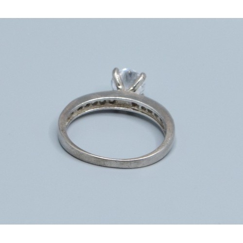 2620 - 925 silver ladies clear gem set solitaire with gem set decoration to the shoulders size P