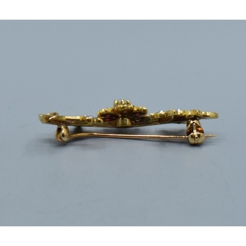 2611 - Fine Ruby and seed Pearl brooch, mounted in 9ct gold measuring 3.7cm in length, 3.3grams