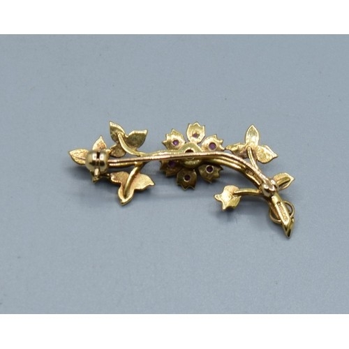 2611 - Fine Ruby and seed Pearl brooch, mounted in 9ct gold measuring 3.7cm in length, 3.3grams