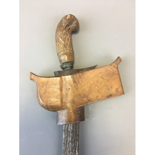 37 - Indonesian Kriss Dagger with Damascus Steel Blade and Carved Handle.