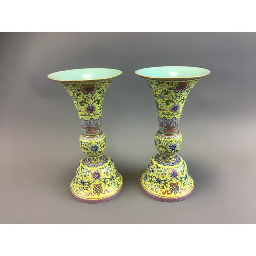 Pair of Qing Dynasty Chinese Yellow Ground Famille Rose Enamel Gu Shaped Vases.