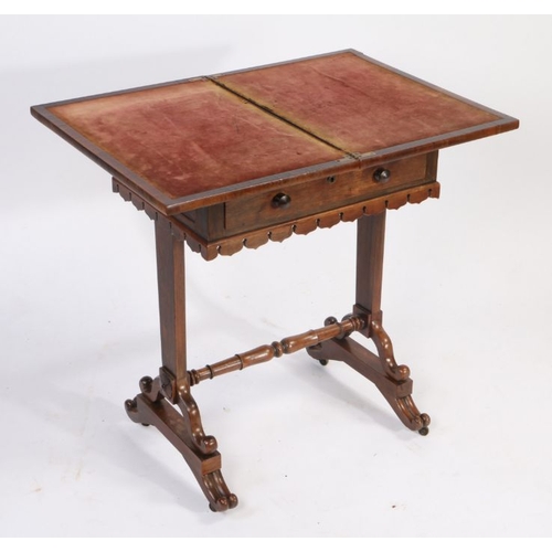 197 - Victorian rosewood games table,, the rectangular folding top opening to reveal a red baize lined int... 