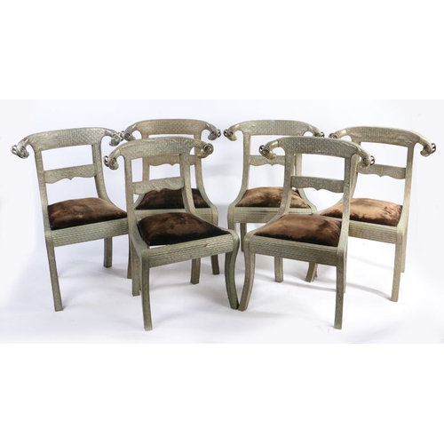 248 - Set of six embossed metal dining chairs, the arched cresting rails with rams head terminals, with ve... 