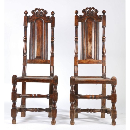 57 - A pair of William & Mary style high-back chairs, with pierced and scroll-carved cresting rails, abov... 