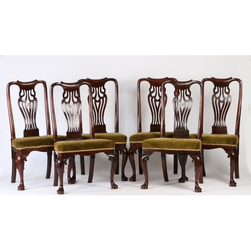 58 - A set of six George III cherry wood dining chairs, the scroll undulating top rail above a wide pierc... 