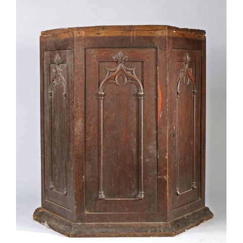 61 - An unusual hexagonal gothic cupboard, with two arched effect panelled cupboard doors and matching pa... 