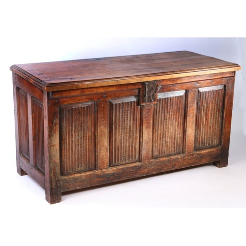 67 - A 17th century cedar linen fold coffer, circa 1600, the hinged lid above four linen fold panels, 143... 