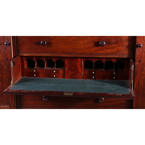 8 - 19th century mahogany compactum wardrobe, the moulded cornice above a drop front section with a sing... 