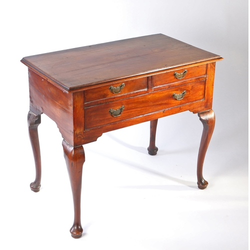 17 - A George III mahogany lowboy, the rectangular top above two short and one long frieze drawer above s... 