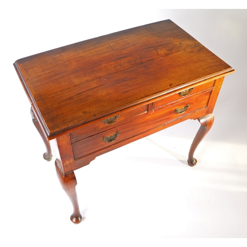 17 - A George III mahogany lowboy, the rectangular top above two short and one long frieze drawer above s... 