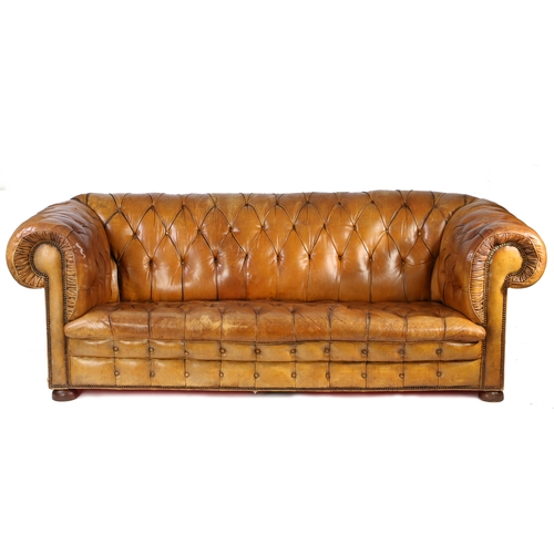 5 - A Victorian leather upholstered chesterfield sofa, the button back and scroll arms above the button ... 