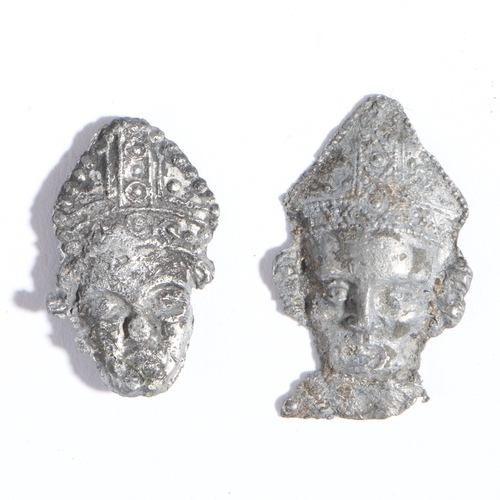 1 - Two mid-14th century pewter pilgrim badges, the head of St. Thomas Becket, circa 1350

 Both a mitre... 