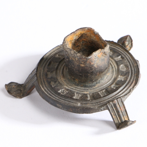 100 - A 14th century pewter votive candlestick

 Having a short cylindrical socket, on a flat circular bas... 