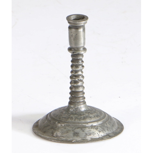 101 - A miniature candlestick, possibly late 17th century, English

 Having a gently flared cylindrical so... 