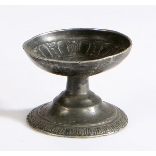 102 - A small pewter cast-decorated footed cup or salt, possibly 16th century, Dutch

 The interior of the... 