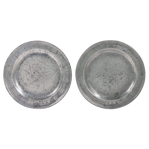 11 - A rare pair of Queen Anne pewter single-reed rim wrigglework marriage plates, circa 1710

 Each rim ... 