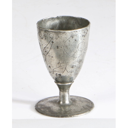 12 - A rare and documented Charles II pewter wrigglework footed wine' cup, circa 1680

 The conical egg-... 