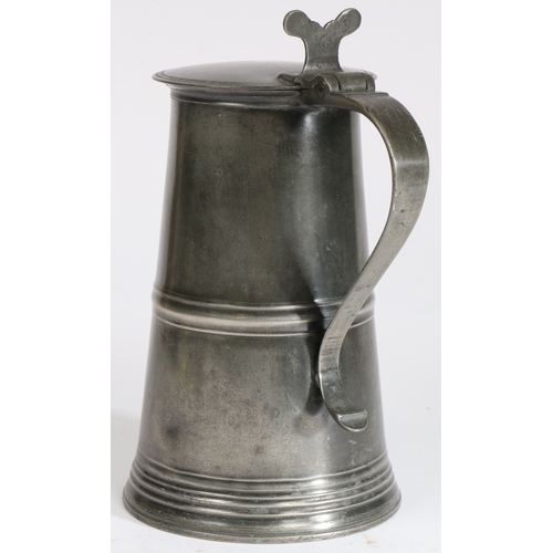 146 - A George III pewter flat-lid flagon, Scottish, circa 1785-1800

 Having a truncated cone body with m... 