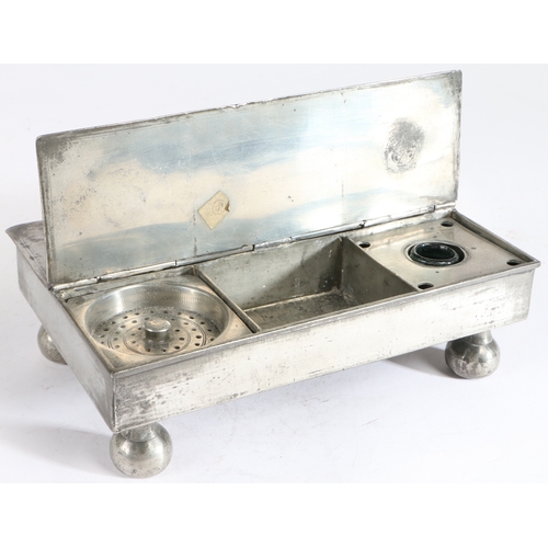 173 - A George III pewter treasury' inkstand, circa 1800

 Of typical flat rectangular twin-flap form, on... 