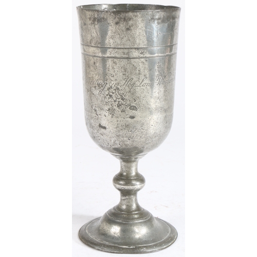 200 - An interesting George II pewter communion cup, dated 1758

 Having an unusually tall cup, with a hig... 