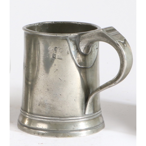 211 - An early 19th century pewter Imperial pint mug, circa 1830

 The truncated cone body with reeded and... 