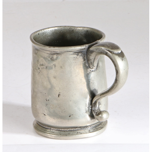 23 - A George II pewter OEWS pint U-shaped mug, Bristol, circa 1740

 With narrow flared lip, and short f... 