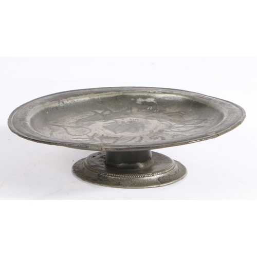 27 - A rare Charles II pewter wrigglework footed plate or tazza, circa 1685

 The plate with narrow reede... 