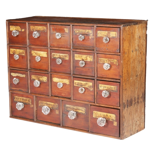 275 - A boarded and joined pine bank of nineteen small apothecary drawers, English, circa 1830-50

 The dr... 