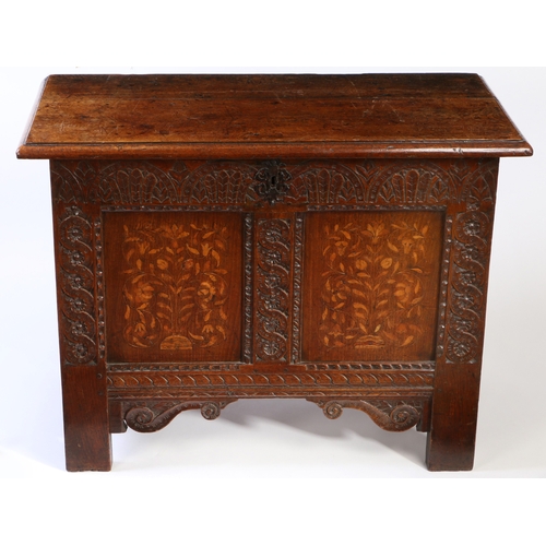 282 - A small James I/Charles I oak and inlaid coffer, Yorkshire. circa 1610-30

 The hinged top off two d... 