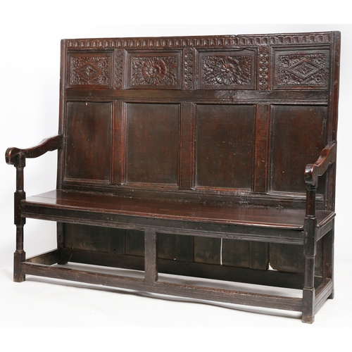 294 - A Charles I oak high-back settle, circa 1640 and later

 The back with a nulled-carved rail, atop fo... 