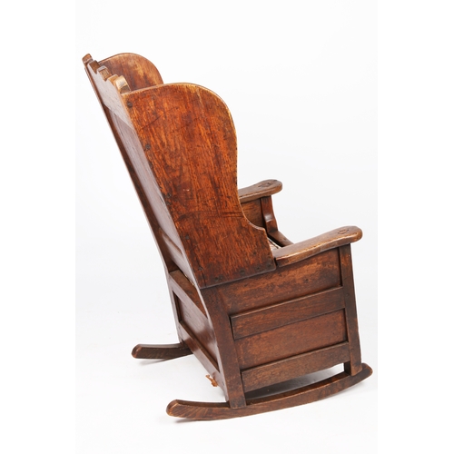 297 - A George I/II oak winged armchair, Welsh, circa 1720-40

 Having a rectangular fielded back with bea... 