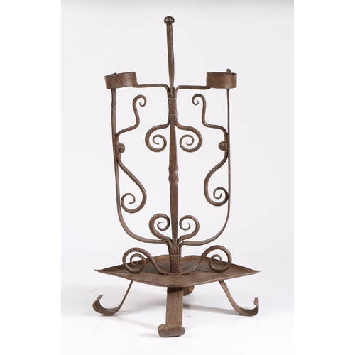 325 - A wrought iron double rushlight or peerman, Scottish

 Possibly 19th century,  having a ball knopped... 