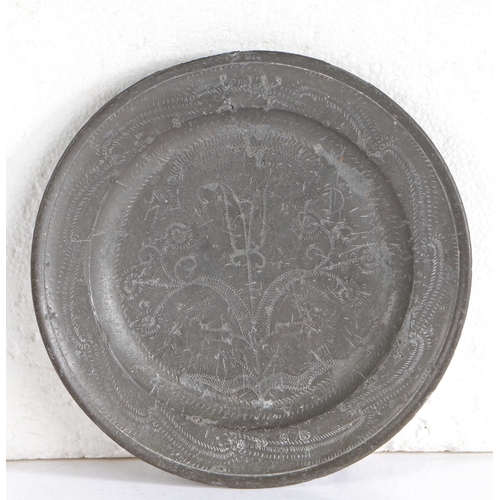33 - A George I pewter wrigglework plate, circa 1715

 Having a single-reed rim, decorated with meanderin... 