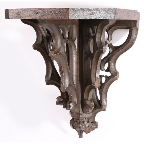 332 - A 19th century carved oak Gothic-Revival bracket, English

 The rectangular top with canted front co... 