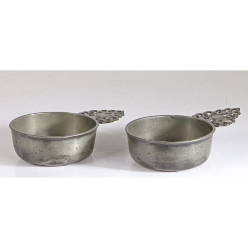 34 - A rare pair of William & Mary pewter porringers, circa 1700

 Each having a straight-sided bowl, fla... 