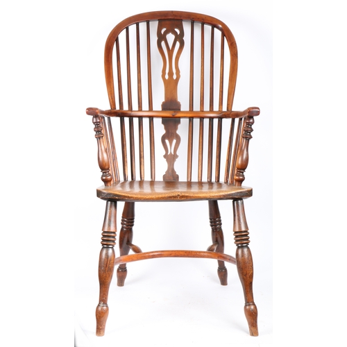 361 - An early Victorian yew and elm high-back Windsor armchair, circa 1840

 The hooped back with four lo... 