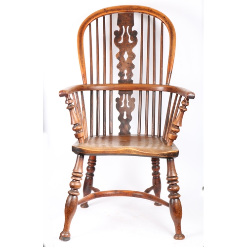 362 - A 19th century yew and elm Windsor armchair, Nottinghamshire, circa 1830

 The hooped back with four... 