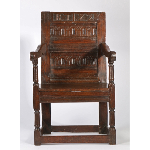 375 - A Charles II oak panel-back open armchair, dated '72'

 The back of two horizontal panels, each bold... 