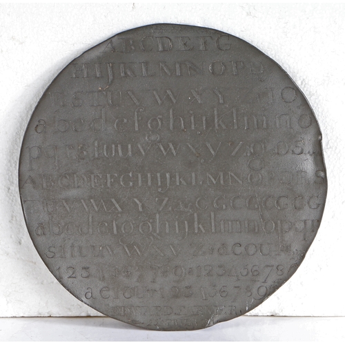 39 - A rare George III pewter hornbook, named and dated 1781

 Of flat circular form, engraved with bands... 