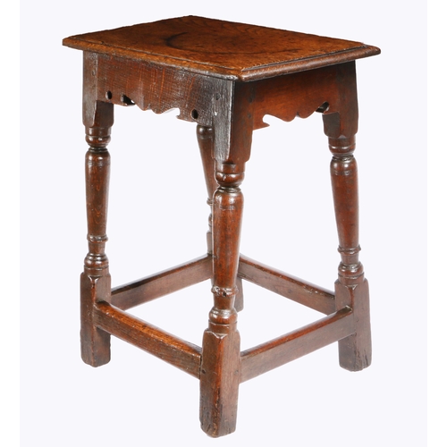 397 - A Charles I oak joint stool, circa 1640

 Having an ovolo-moulded top, bicuspid-shaped rails, on bal... 