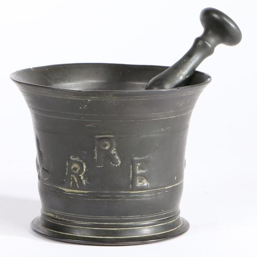 405 - A Charles II bronze alloy mortar and pestle, Suffolk, dated 1672

 The flared body cast with the dat... 