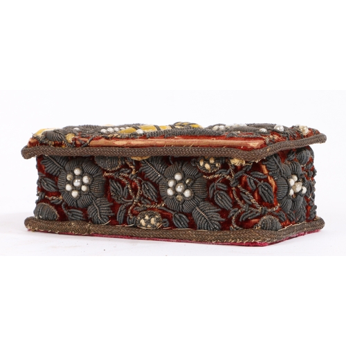 409 - A small stumpwork casket

 Designed with foliate beaded decoration, 13cm wide, 7.5cm deep, 5cm high