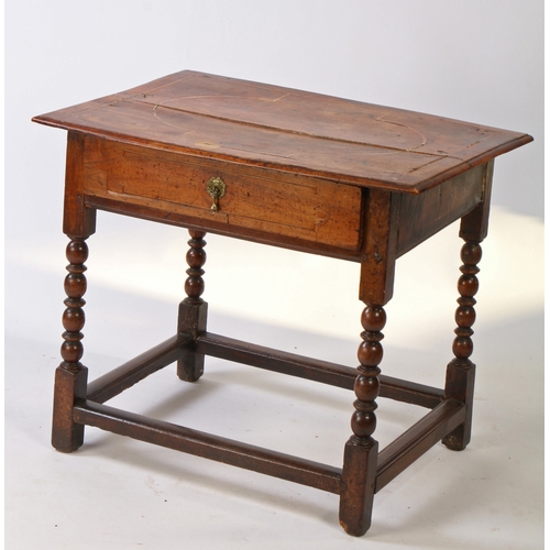 449 - A William and Mary walnut and linear-inlaid side table, circa 1700

 The top of two boards, with ovo... 