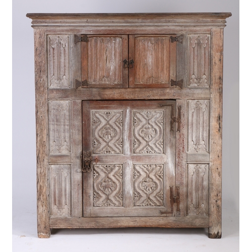 453 - A 16th century style oak livery cupboard, circa 1900 

 In the Wardour Street manner, English, with ... 