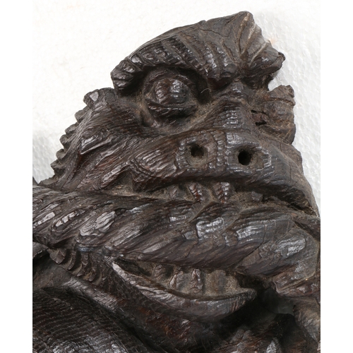 458 - A rare 15th century oak dragon-carved boss, English, circa 1400

 The snarling, winged beast clenchi... 