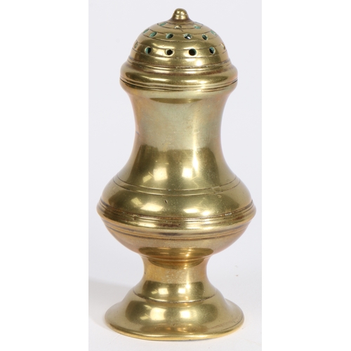 490 - A George III cast brass pepperette, circa 1780

 Of baluster silver-form, the domed pierced lid with... 