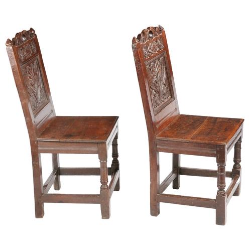 491 - A pair of Charles II oak backstools, Lancashire, circa 1670

 Each with a fully-enclosed back having... 