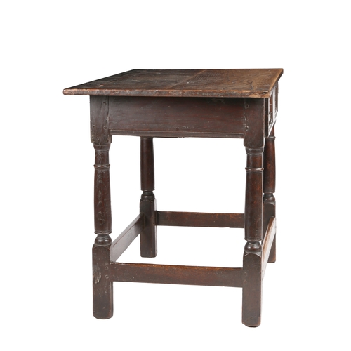 492 - A Charles II oak and yew side table, circa 1660

 Having an end-cleated twin-boarded top, single fri... 