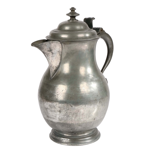 50 - A mid-18th century pewter baluster-shaped laver/flagon, circa 1750

 Having a domed lid with two-tie... 