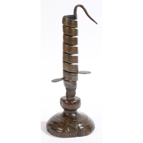 503 - A rare and good English iron spiral candlestick, with turned oak base, probably Penrith, Cumbria, ci... 